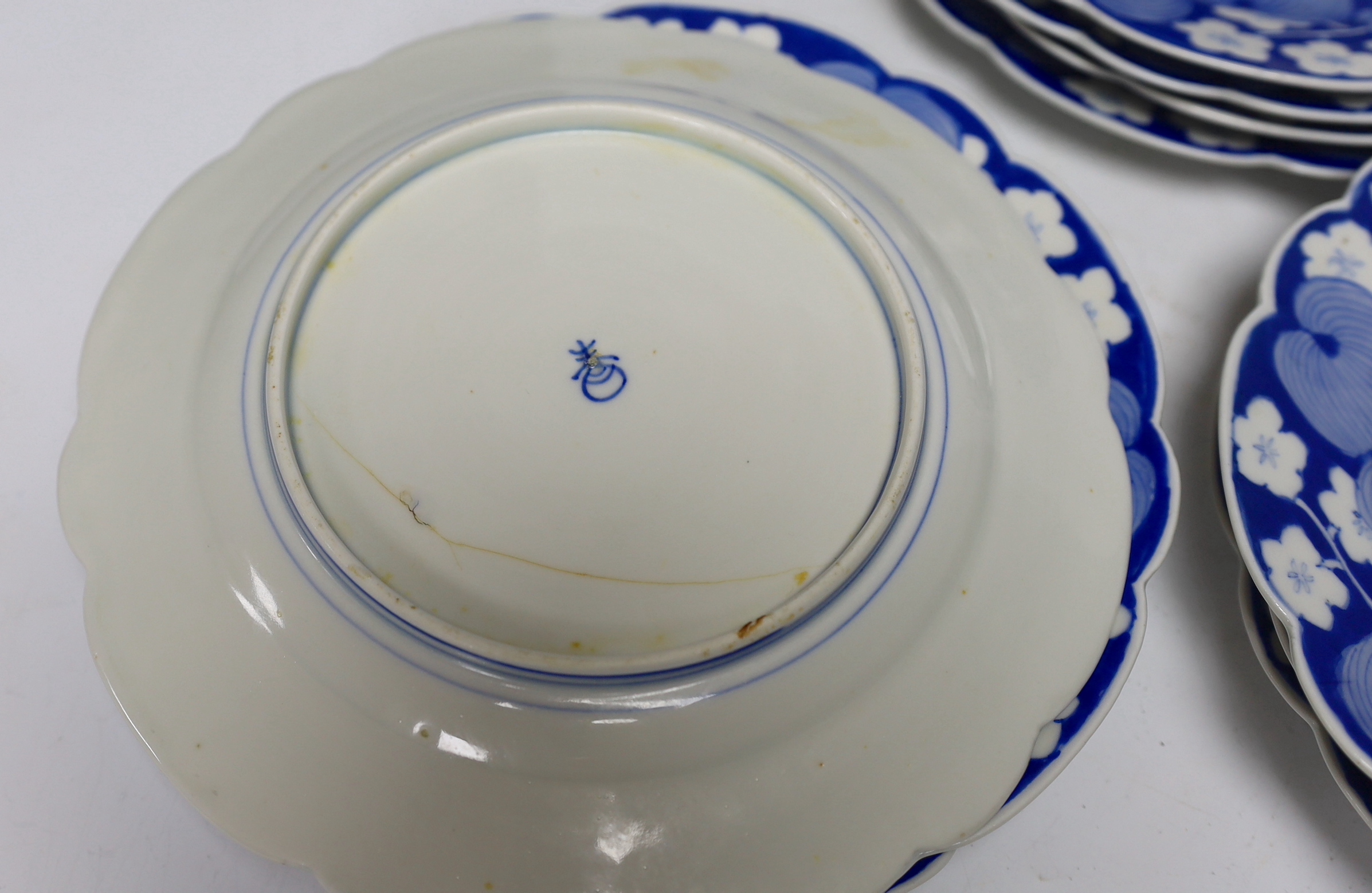 Twelve Japanese blue and white ‘fish’ plates, 21cm diameter